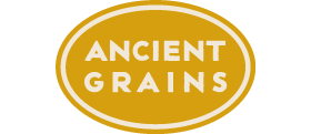 Ancient Grains category logo: The word ANCIENT GRAINS, centered in a golden yellow oval with a thin, inset cream colored border.
