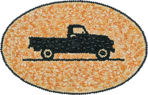 A mosaic image of a vintage black truck centered in an oval - the mosaic is comprised of Edison Grainery organic ingredients. 