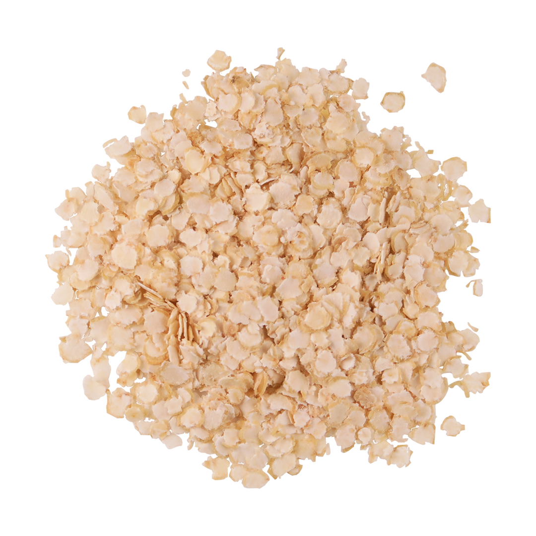 A small, top-view puddle of organic quinoa flakes.